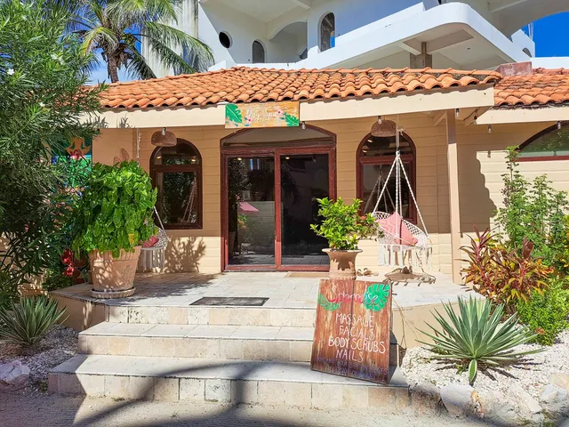 a view of a chairs and table in a patio