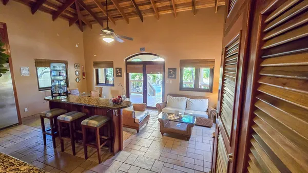 a view of a dining room with furniture and window