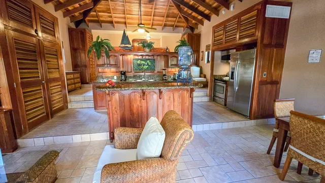a view of a patio with dining table and chairs