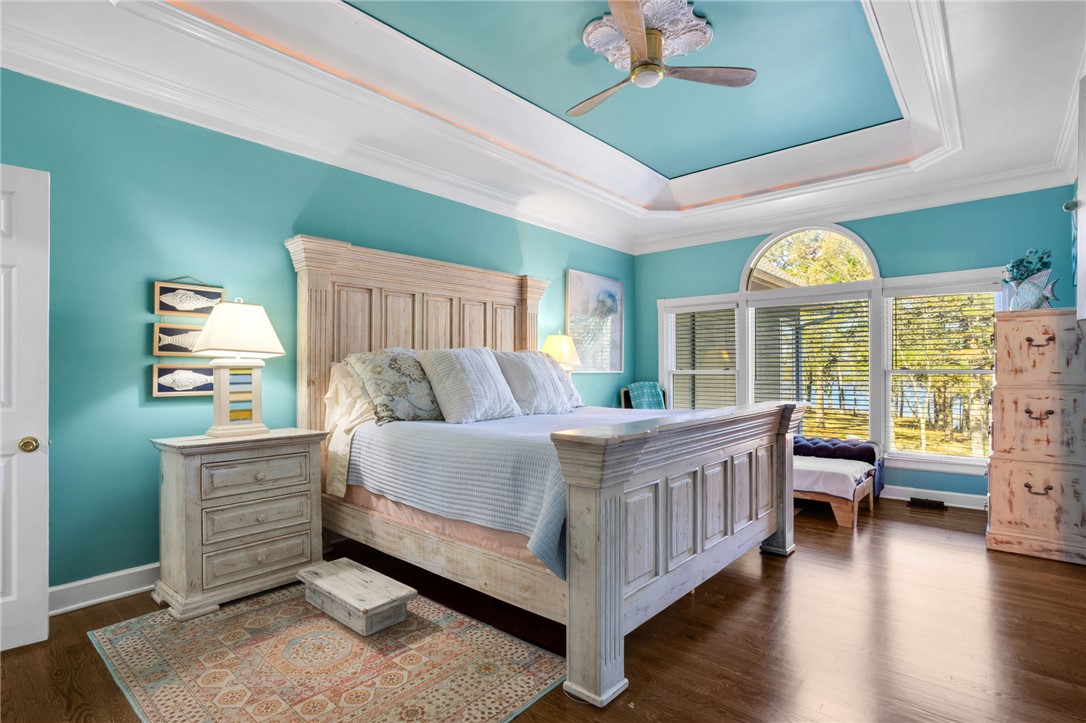 1133 Elrod Ferry Road Hartwell, GA 30643 - Photo 22 of 46 This tranquil bedroom features elegant crown molding and rich hardwood flooring.
