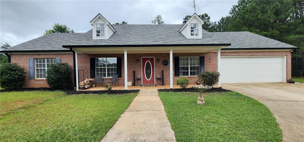 365 Richards Chapel Road Covington, GA 30016 - Photo 1 of 1 a front view of a house with a yard