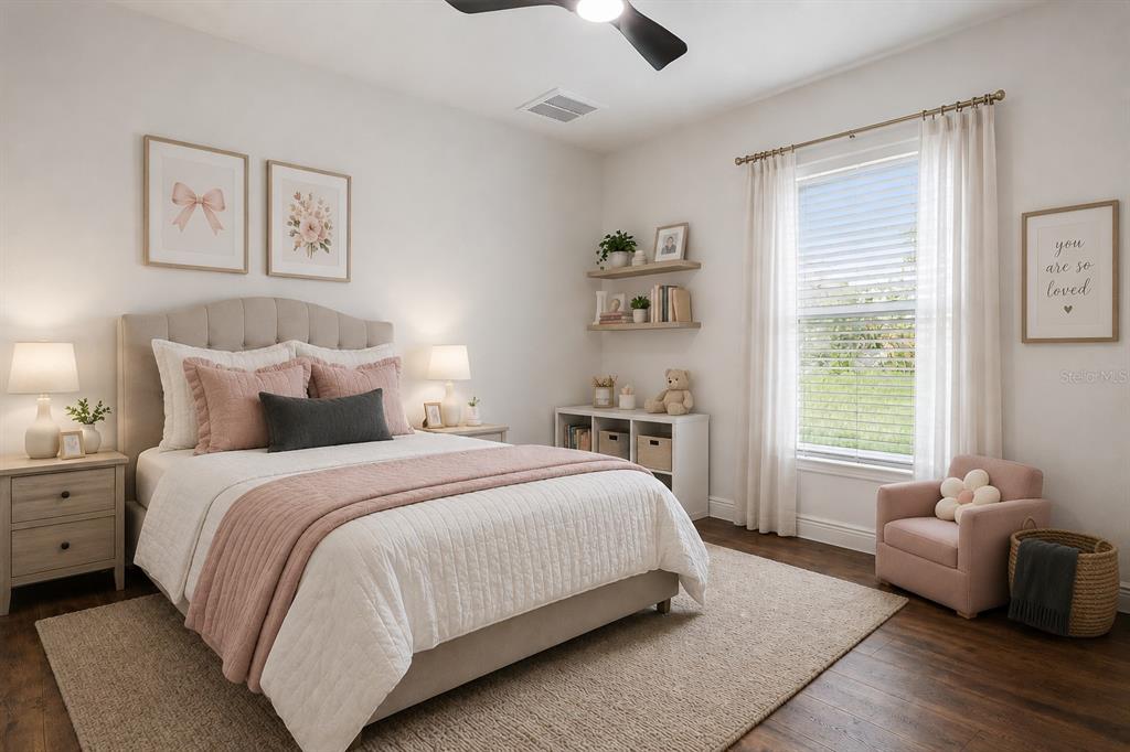 9412 Noddy Tern Road Weeki Wachee, FL 34613 - Photo 21 of 35 a bedroom with a bed and a couch