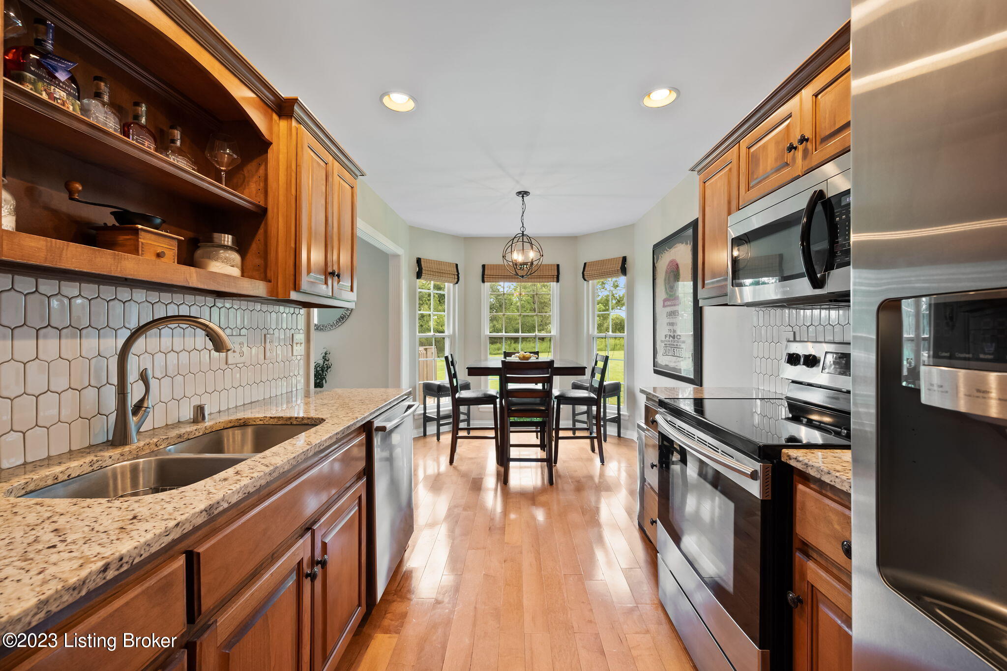4610 Stone Ridge Road Crestwood, KY 40014 - Photo 17 of 52 The granite counters (2017) compliment the tiled backsplash (2020) beautifully