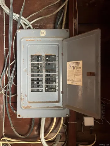 a front view of a house with outdoor seating