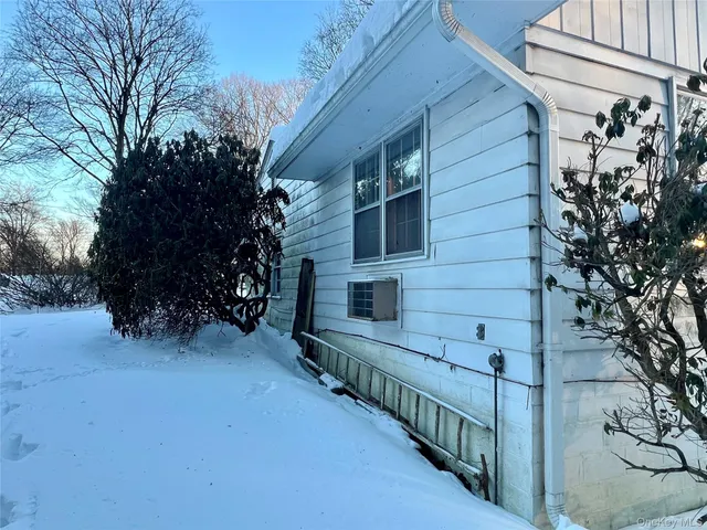 a view of a house with a tree