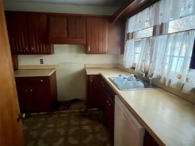 a kitchen with a sink and cabinets