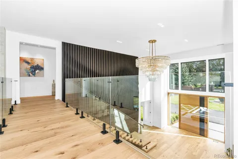 a view of an entryway with wooden floor