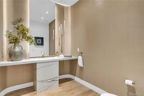a view of a livingroom with furniture and a potted plant
