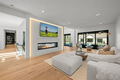 a spacious bedroom with a bed and large window