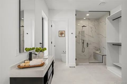 a living room with furniture a large window and a flat screen tv