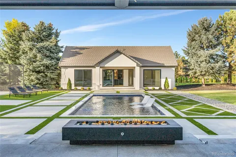 a living room with furniture a rug and a large window