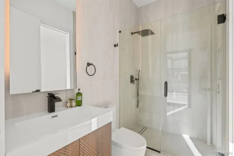 a room with furniture projector and screen