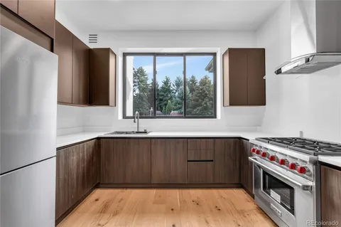 an outdoor patio with chairs and a table