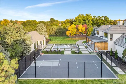 an aerial view of a house with a swimming pool yard and outdoor seating