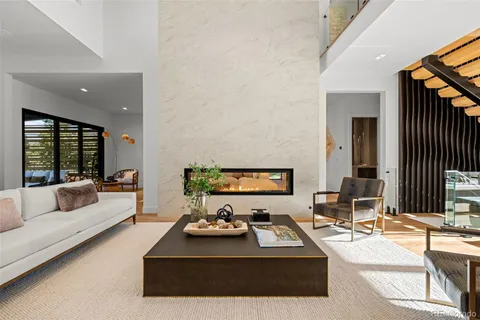 a living room with furniture rug and window