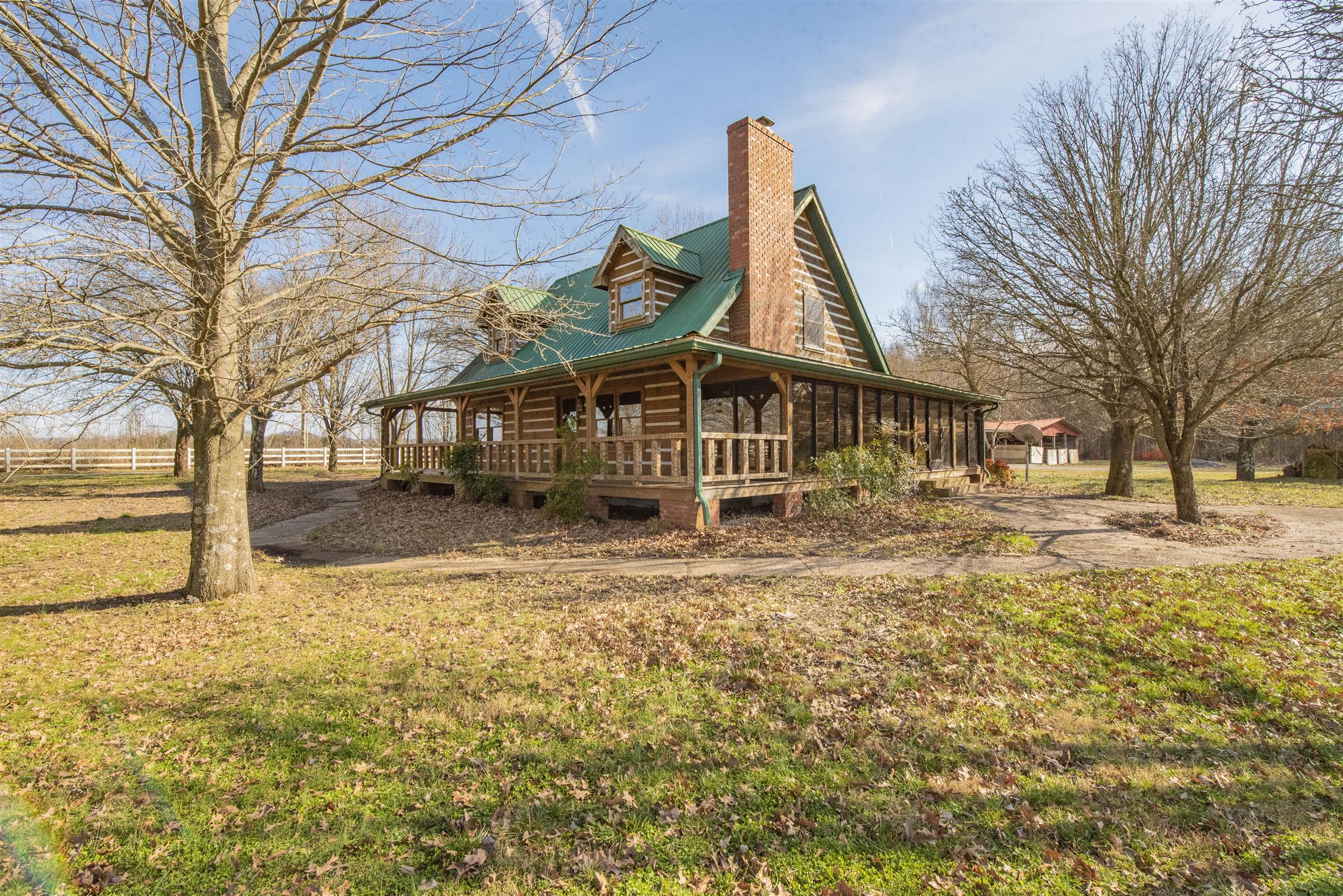 4936 Sledge Road Christiana, TN 37037 - Photo 2 of 30 View showing glassed in side porch and patio.