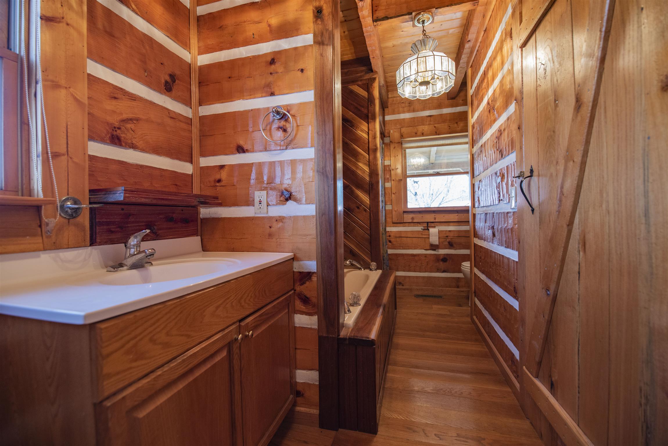 4936 Sledge Road Christiana, TN 37037 - Photo 11 of 30 Downstairs bathroom with jacuzzi tub and direct access to adjacent laundry room so no unnecessary tracking in of dirt from outside.