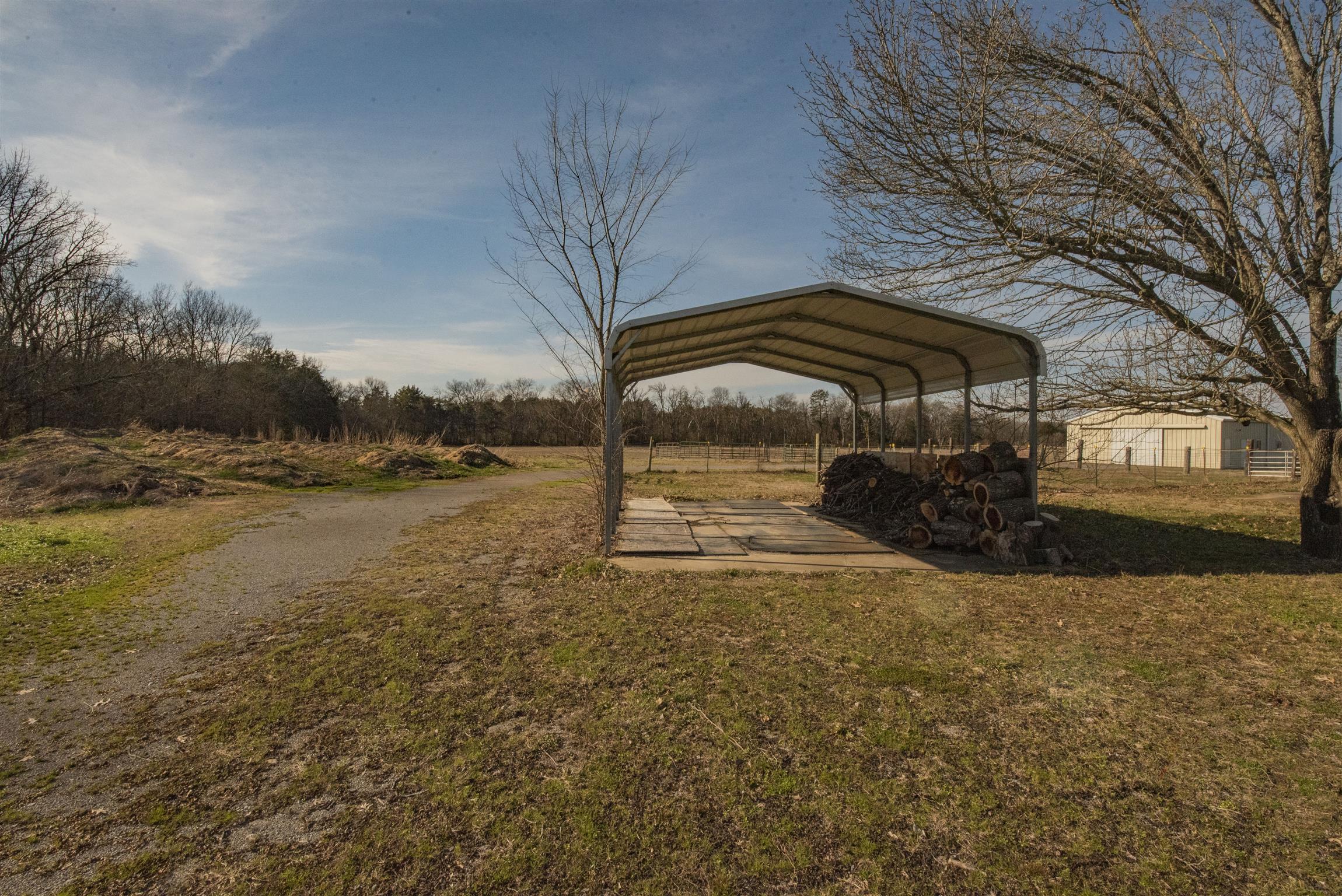 4936 Sledge Road Christiana, TN 37037 - Photo 22 of 30 Single car carport on a concrete slab complete with firewood ready and waiting.
