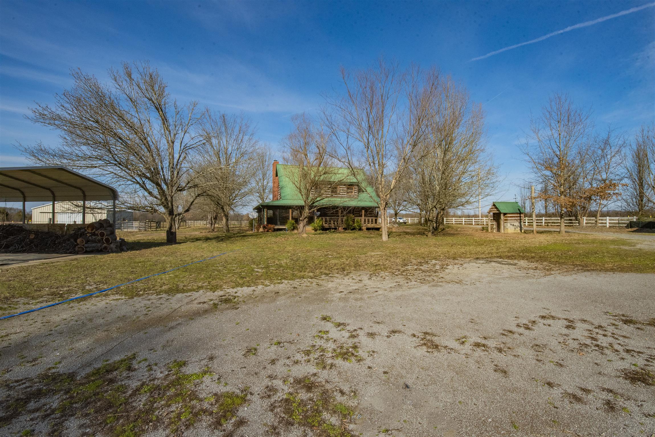4936 Sledge Road Christiana, TN 37037 - Photo 24 of 30 View of back yard, rear of the house and the well house to the right.