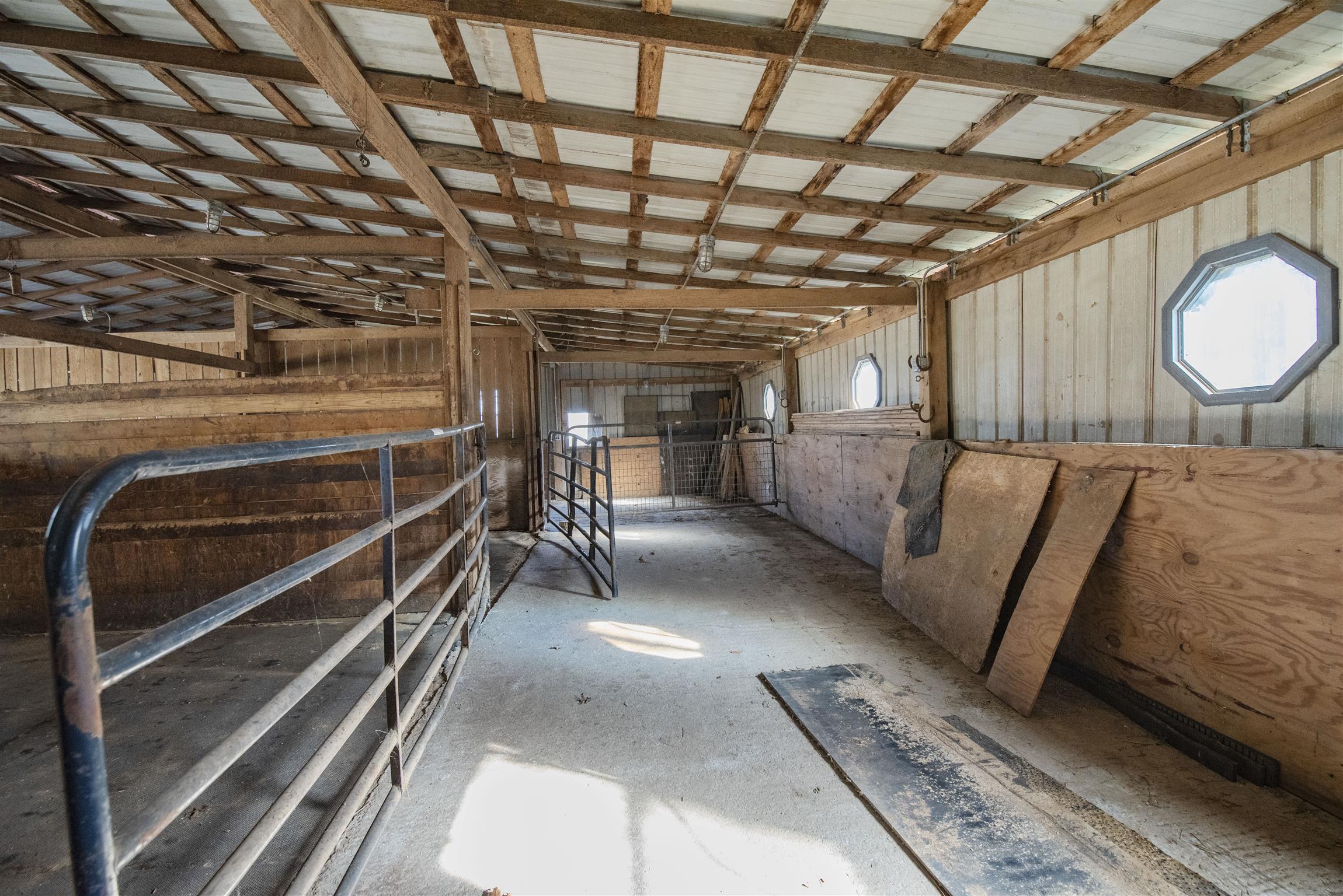 4936 Sledge Road Christiana, TN 37037 - Photo 29 of 30 The barn features (12) 12x12 stalls w/rubber mats over gravel, plenty of head room & versatility with removable walls between stalls.