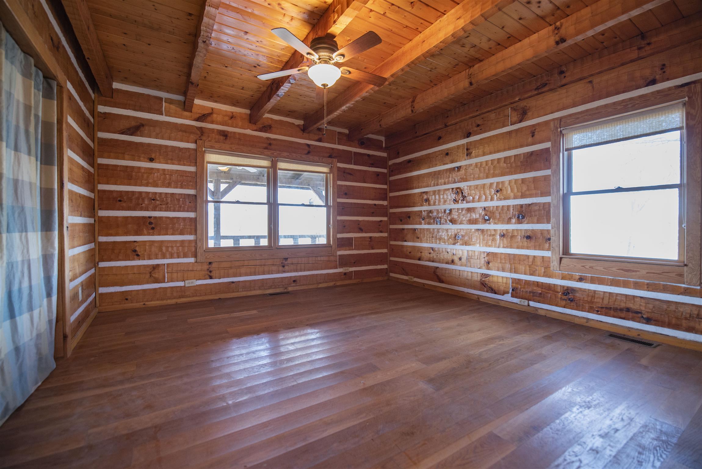 4936 Sledge Road Christiana, TN 37037 - Photo 10 of 30 Downstairs bedroom exemplifies how beautifully all of the wood surfaces give such a homey feel.