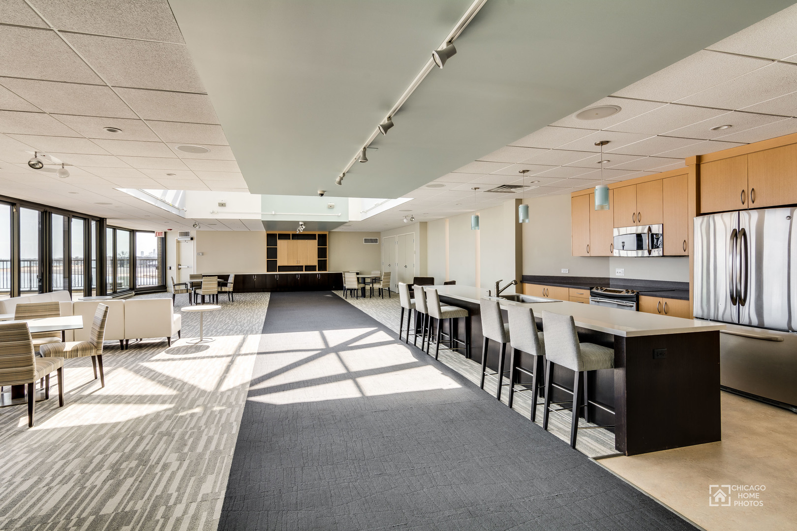 6007 North Sheridan Road, Unit 17DF Chicago, IL 60660 - Photo 15 of 20 a living room with stainless steel appliances kitchen island granite countertop lots of white furniture a sink a stove and a refrigerator