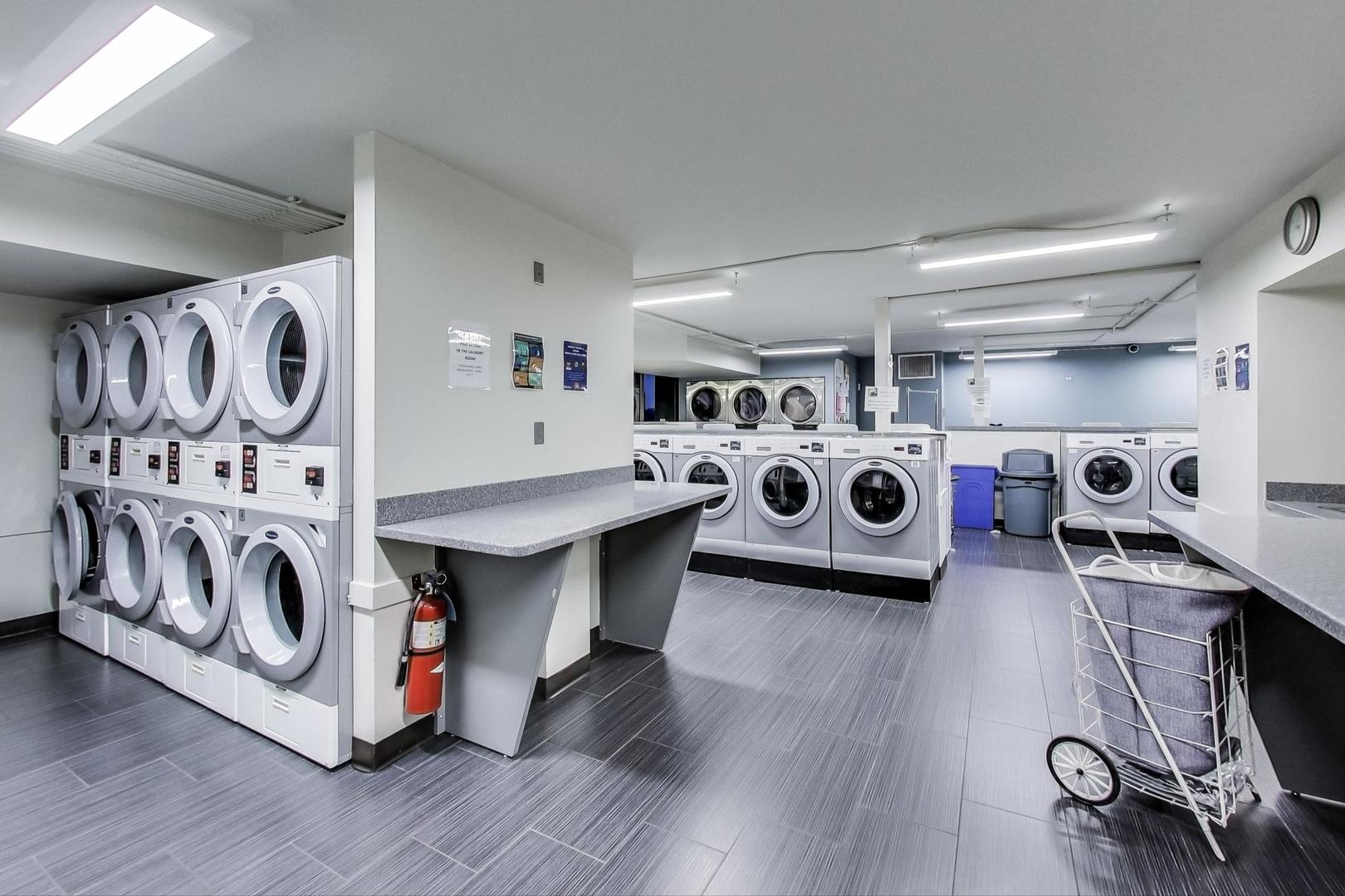 6007 North Sheridan Road, Unit 17DF Chicago, IL 60660 - Photo 20 of 20 a view of a kitchen with stainless steel appliances granite countertop a stove and a wooden floor