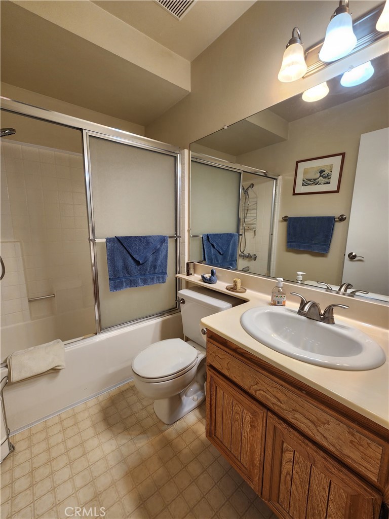 20334 Rue Crevier, Unit 622 Canyon Country, CA 91351 - Photo 16 of 22 a bathroom with a double vanity sink mirror and toilet