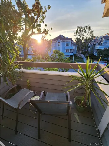 a view of a house with pool and chairs
