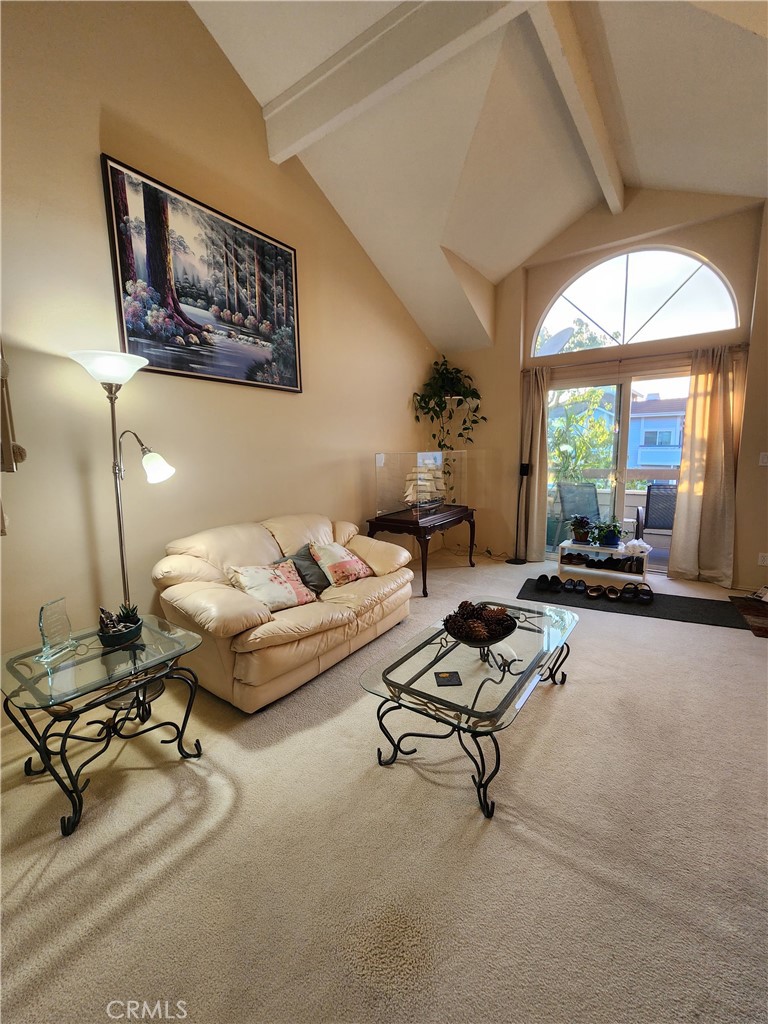 20334 Rue Crevier, Unit 622 Canyon Country, CA 91351 - Photo 9 of 22 a living room with furniture gym equipment and a large window