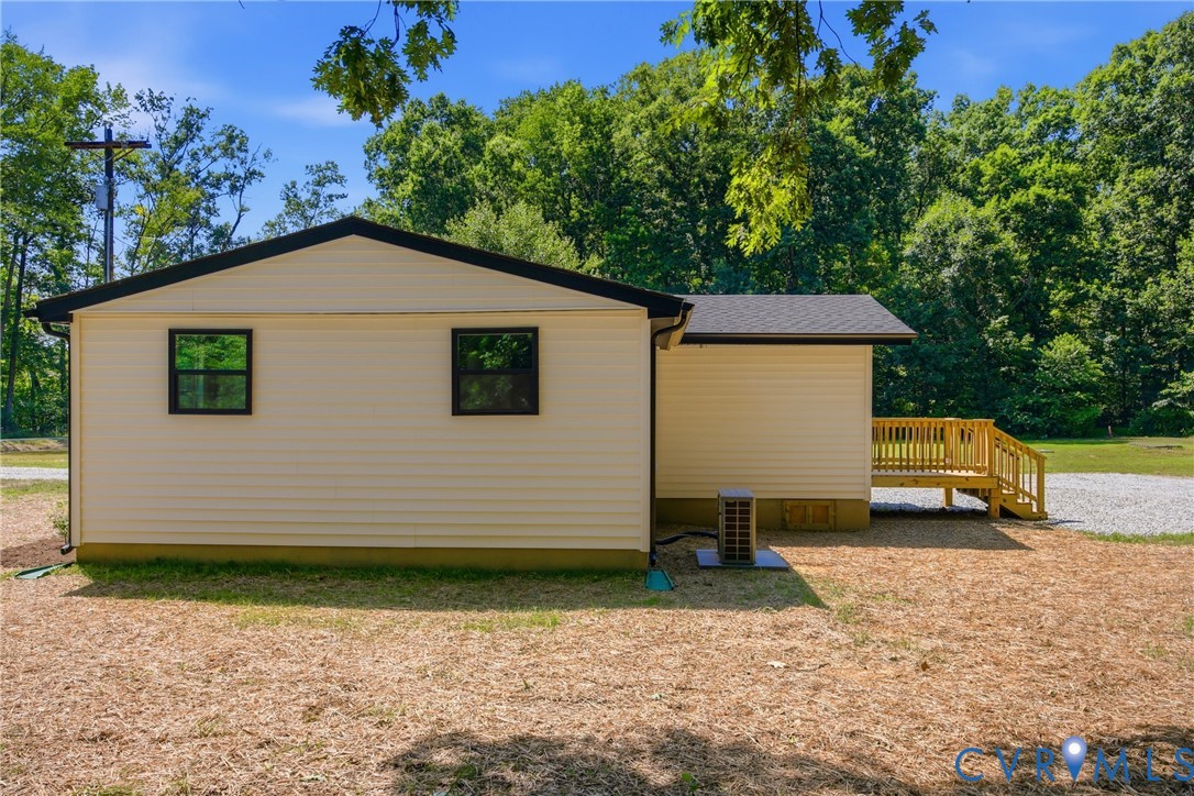 3497 Bumpass Road Beaverdam, VA 23015 - Photo 22 of 28 Cream-colored siding exterior featuring black-fram