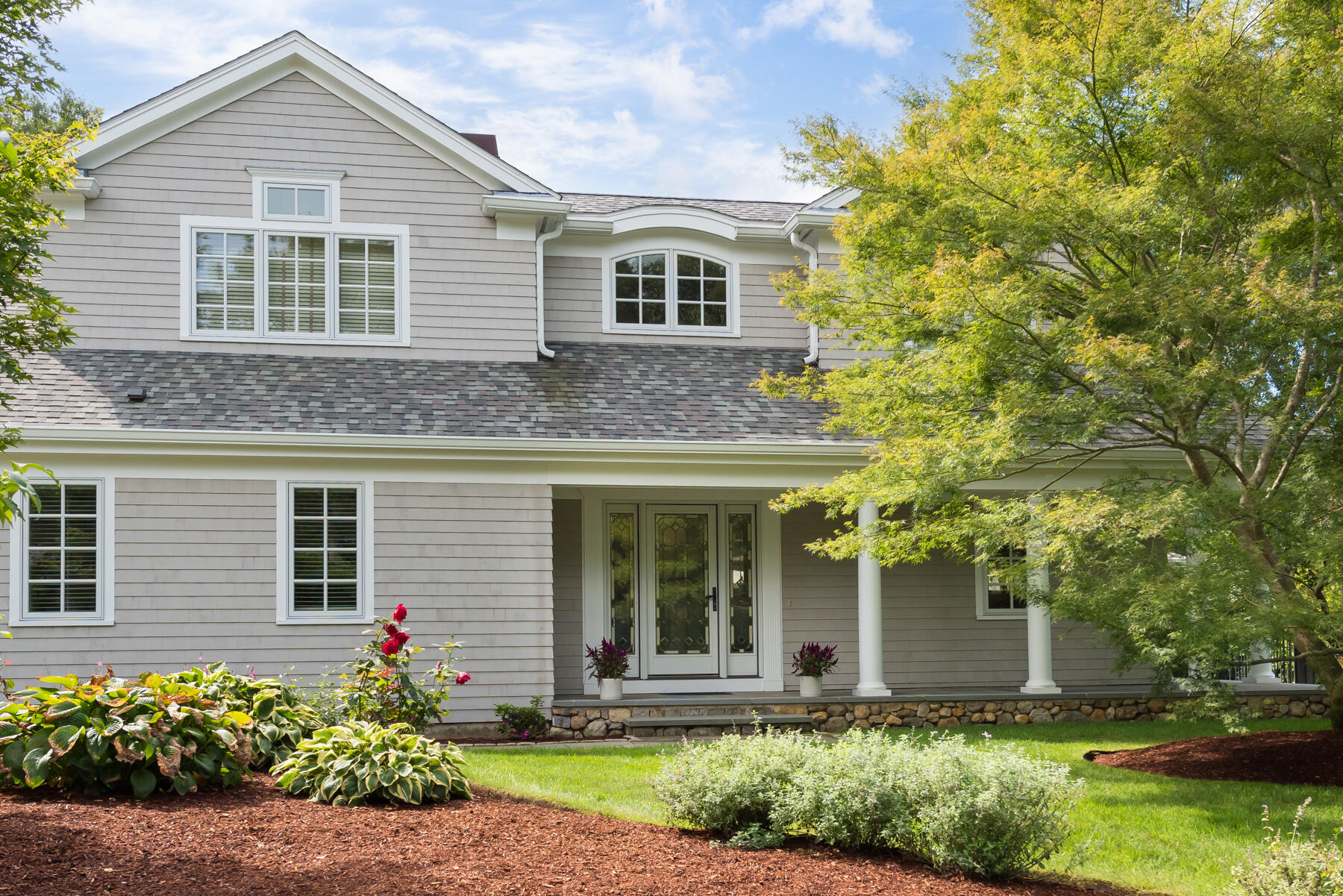 2 Open Space Drive Sandwich, MA 02563 - Photo 49 of 56 a front view of a house with a yard and potted plants