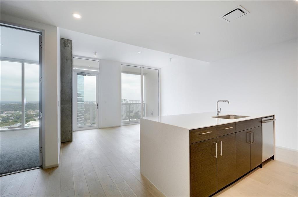 301 West Avenue, Unit 1202 Austin, TX 78701 - Photo 5 of 27 a view of a kitchen with a sink and a large window