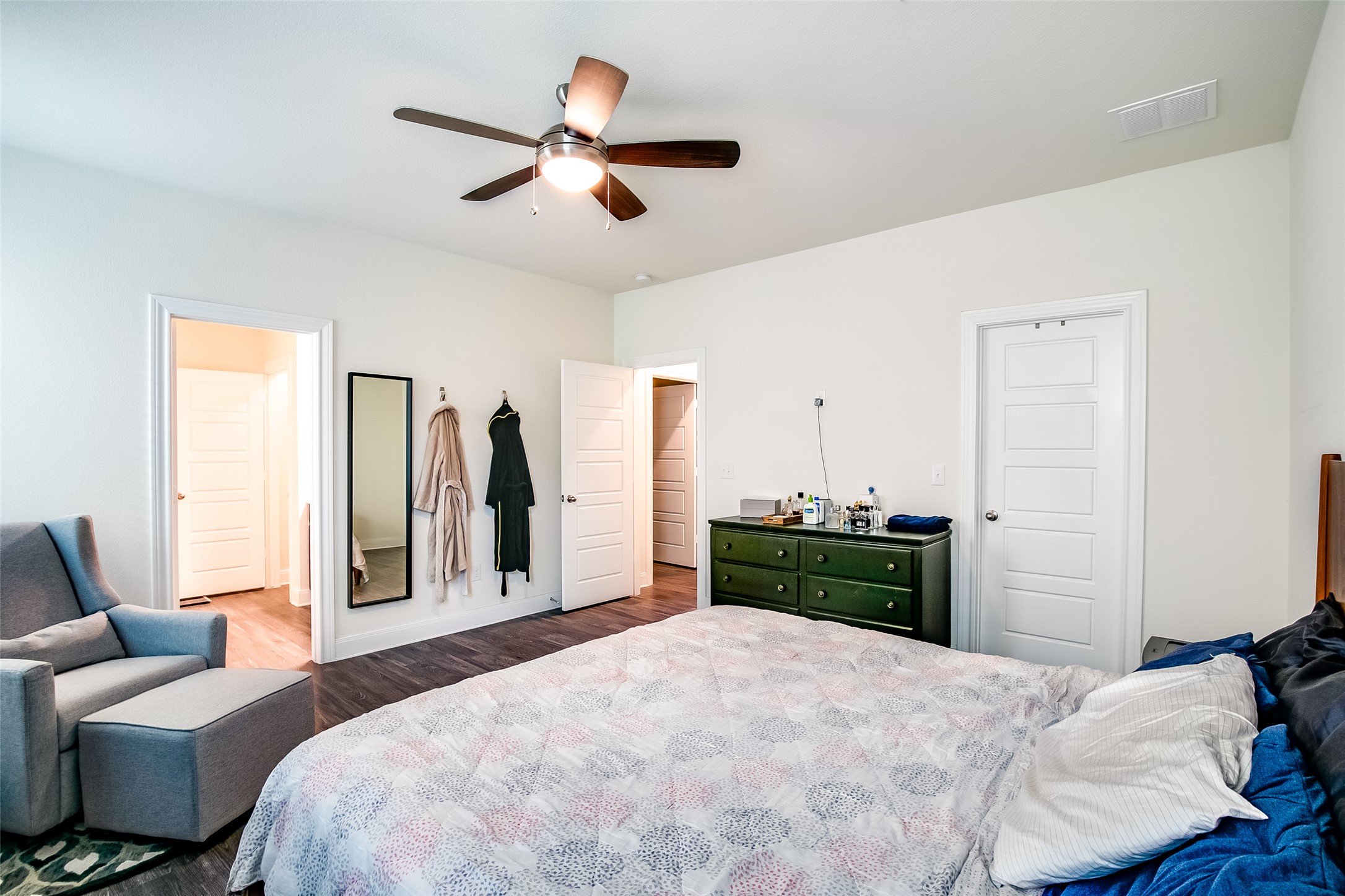 7616 Groundhog Way Austin, TX 78744 - Photo 20 of 34 a bedroom with a bed and a large mirror