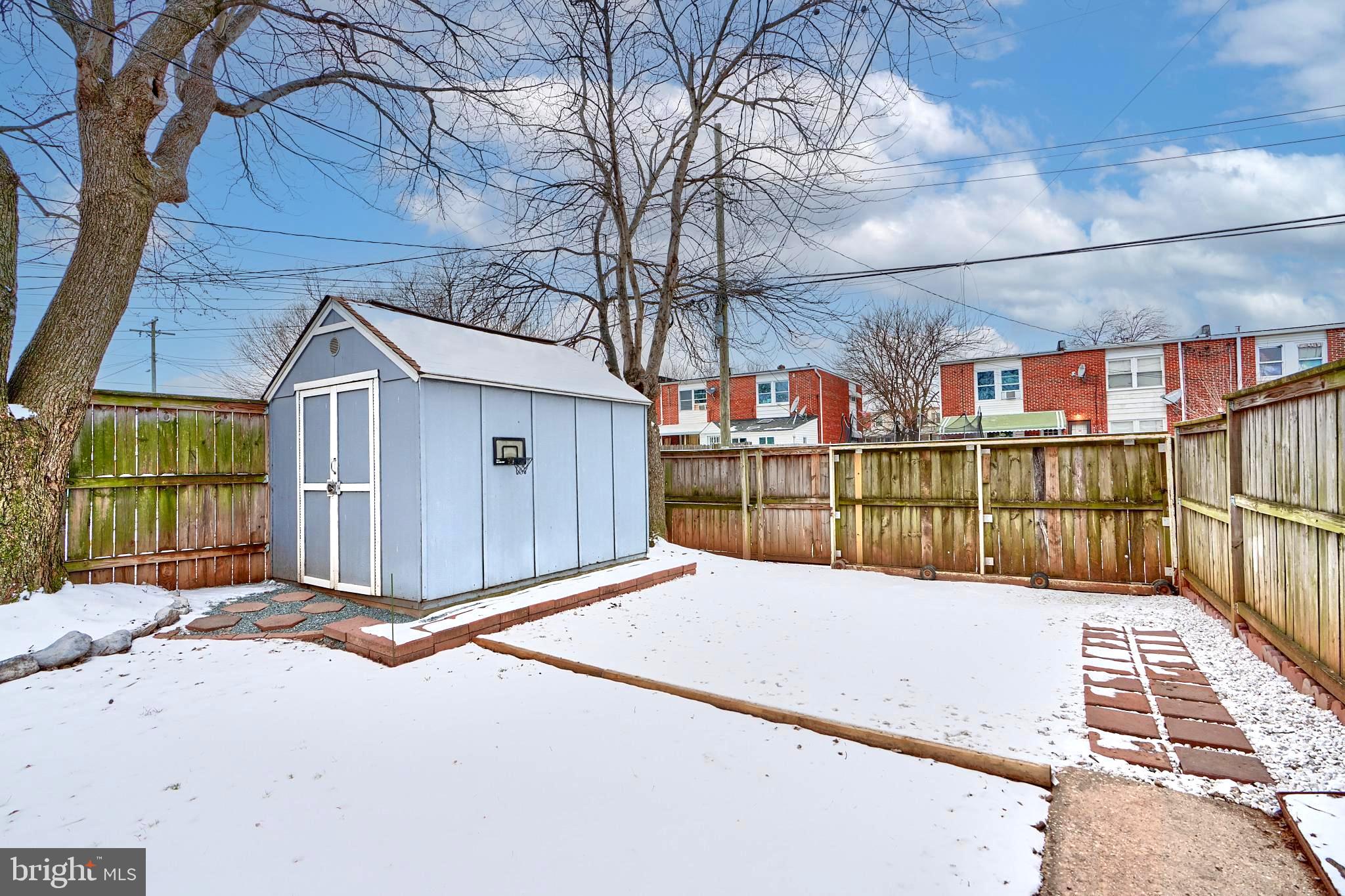 8014 Lansdale Road Baltimore, MD 21224 - Photo 36 of 41 ROLLING CAR GATE, STONE PARKING SPACE BESIDE SHED
