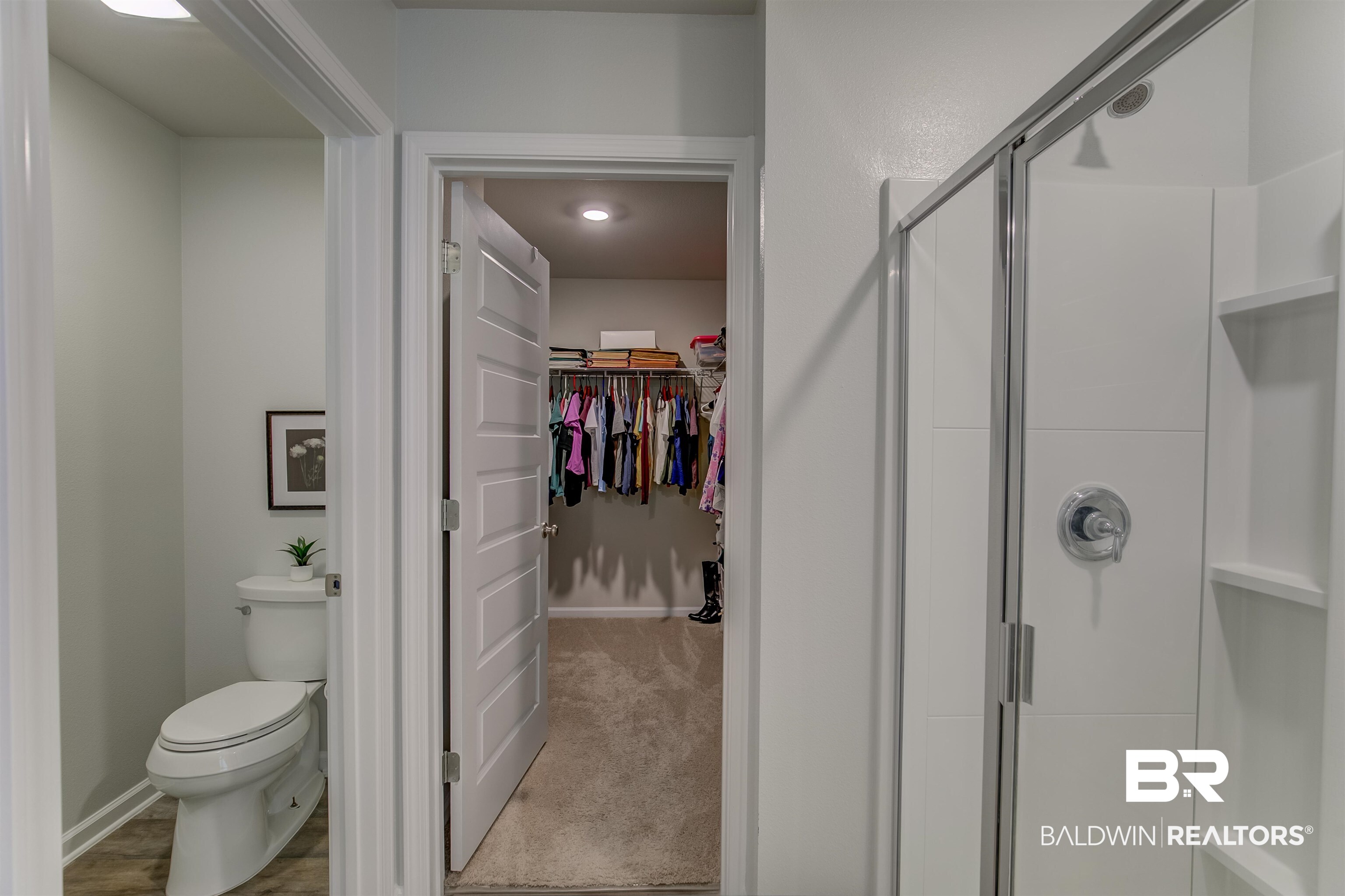 8033 Irwin Loop Daphne, AL 36526 - Photo 26 of 38 Walk-in shower with sliding glass door and built-in shelving