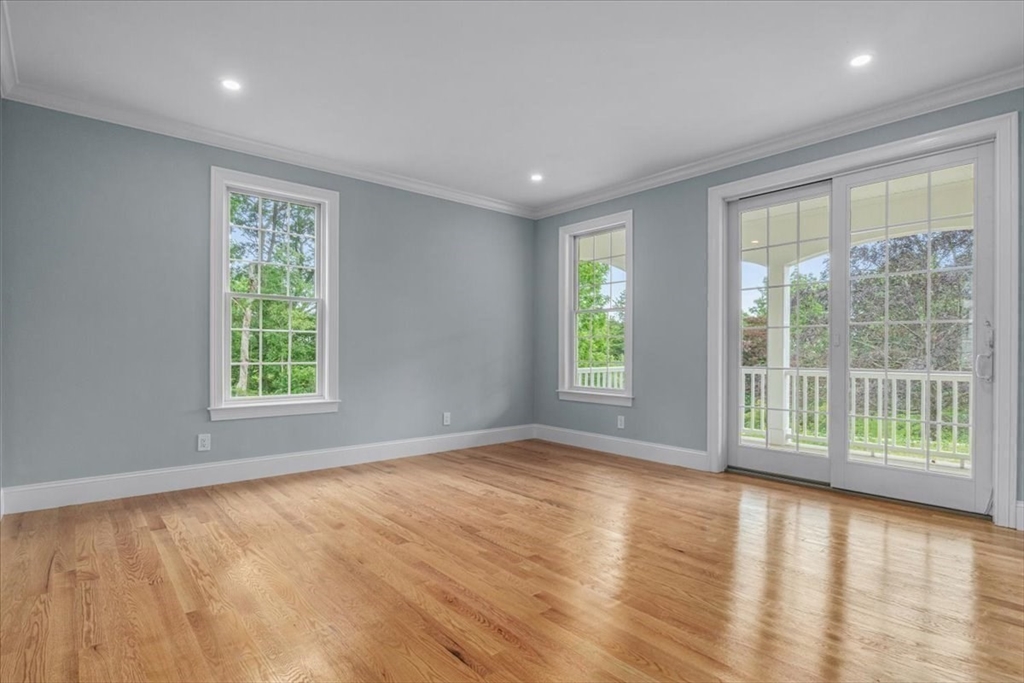 35 Shuttleworth Dedham, MA 02026 - Photo 11 of 28 a view of an empty room with wooden floor and a window