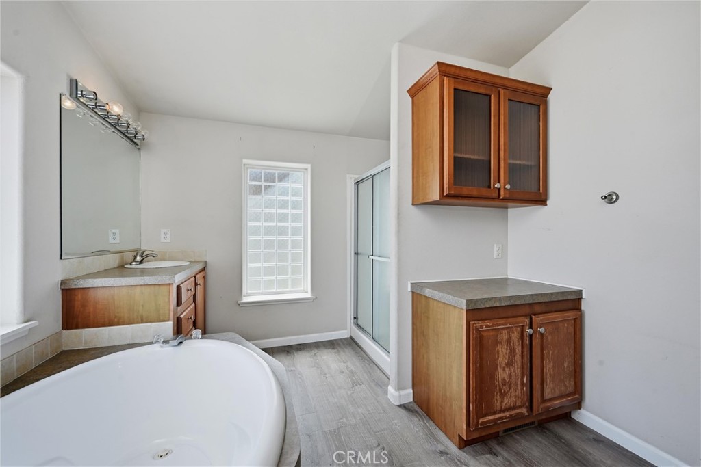 2860 Spring Valley Road Clearlake Oaks, CA 95423 - Photo 23 of 38 a bed room with a bed and a window