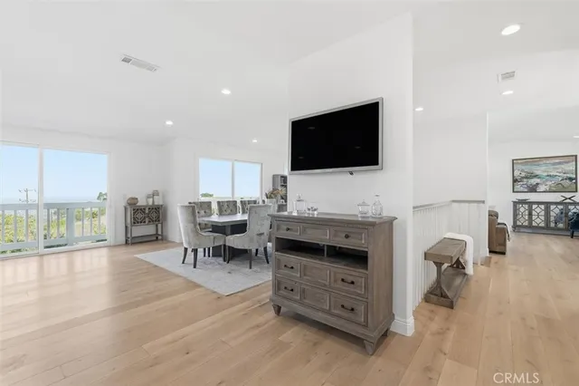 a kitchen with stainless steel appliances granite countertop a stove a sink and white cabinets