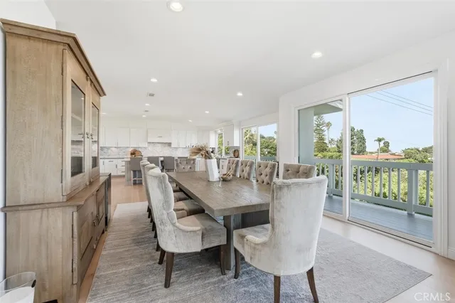 a kitchen with stainless steel appliances granite countertop a sink and a stove top oven
