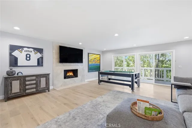 a living room with furniture and large window