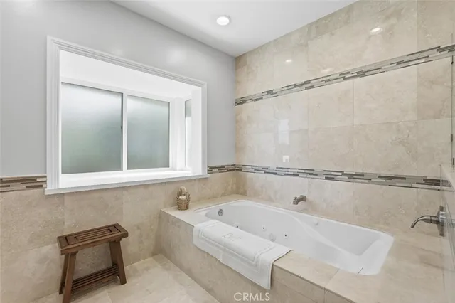 a room with gym equipment and a flat screen tv