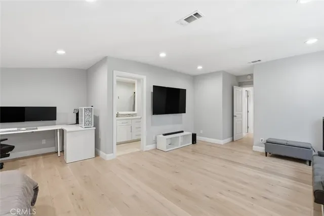 a aerial view of a house with balcony and trees al around