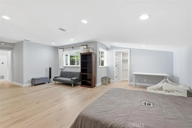 a view of balcony with furniture and wooden floor