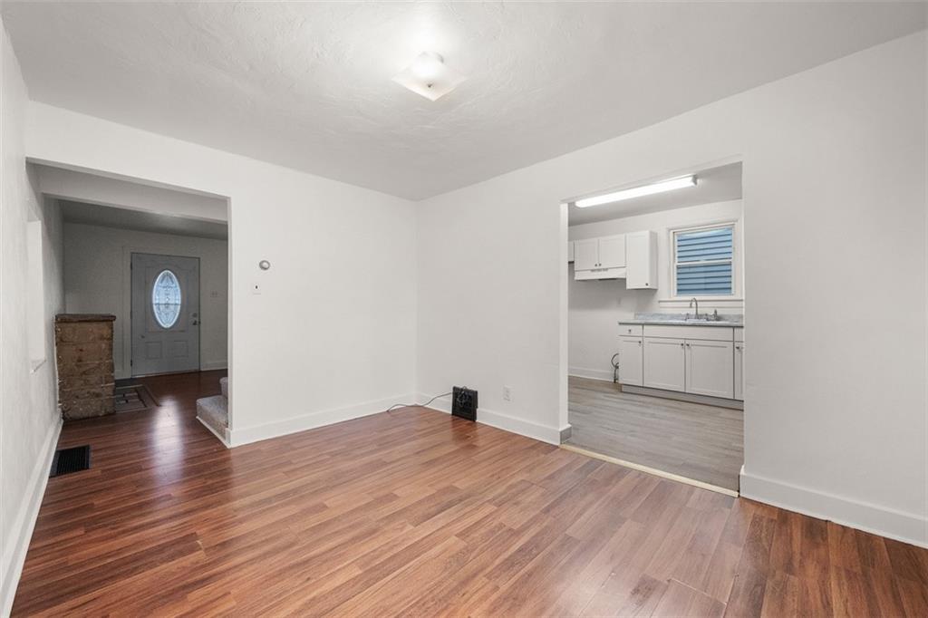 1128 9th Street McKees Rocks, PA 15136 - Photo 11 of 33 a view of a room with wooden floor and a sink