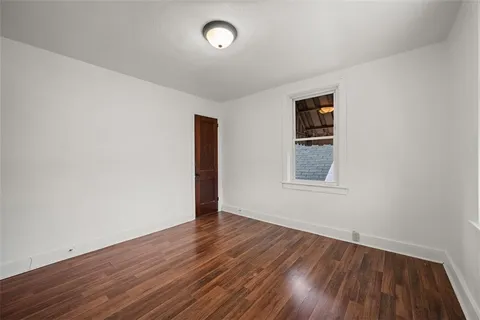 a white toilet sitting next to a bathroom sink