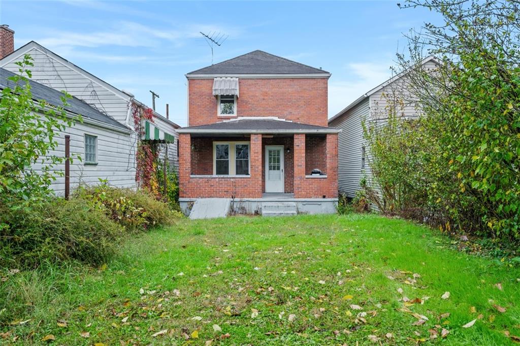 1128 9th Street McKees Rocks, PA 15136 - Photo 29 of 33 a front view of a house with yard
