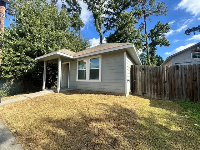 a kitchen with stainless steel appliances a stove microwave and refrigerator