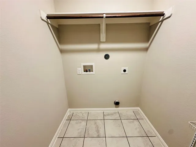 a living room with a chandelier furniture and a large window