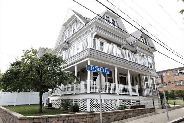 40 Evergreen Avenue, Unit 1 Somerville, MA 02145 - Photo 17 of 24 a front view of a building with garden